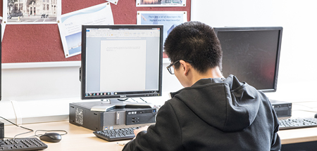 Student works at a desktop computer