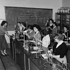 A historical photo of a group of women working in a science lab