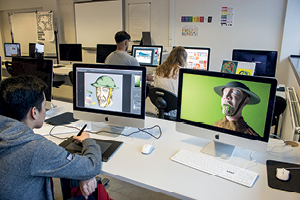 Students uses an Apple Macs to produce digital illustrations