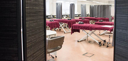 Large beauty salon with massage couches ready for use