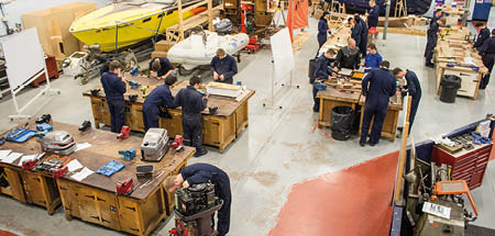 Overhead view of students at work benches in large Marine Skills Centre workshop