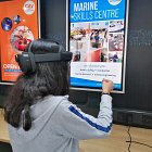 Young person with headset using future technology